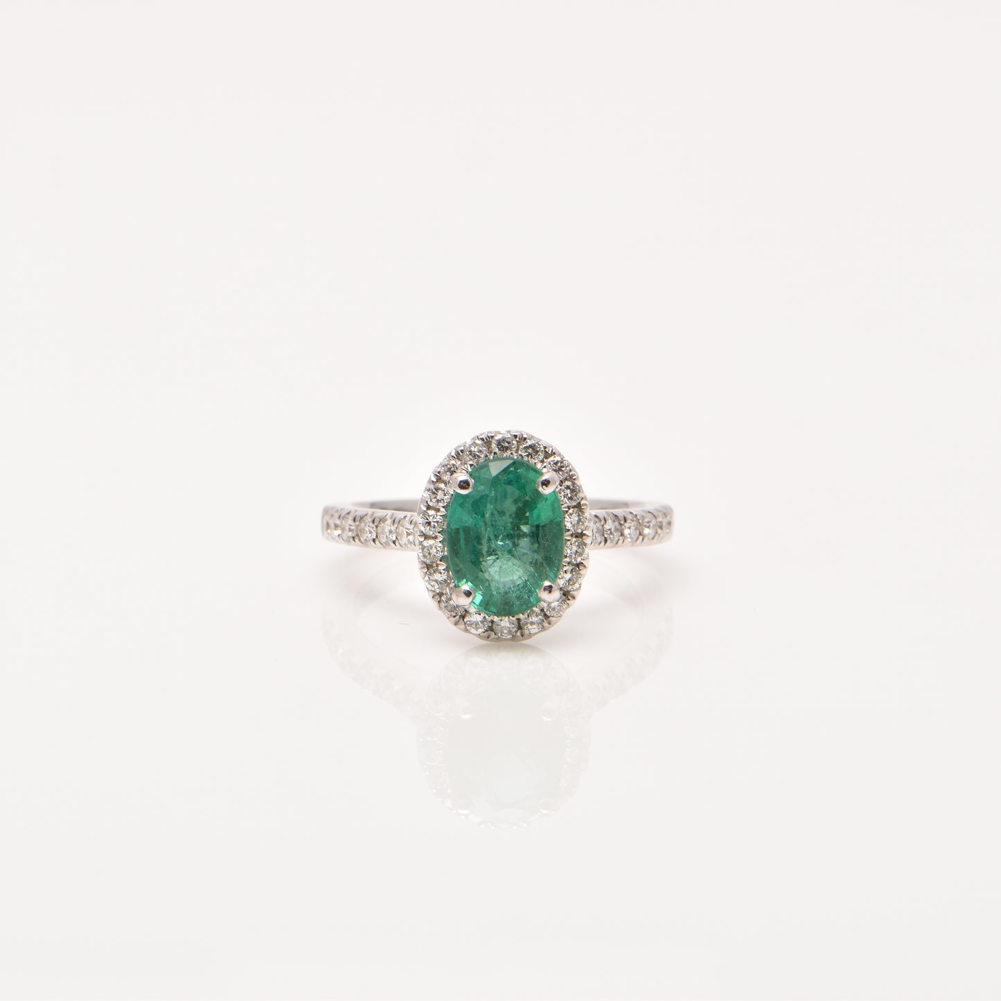 Emerald and Diamond Halo Ring in 18ct Gold